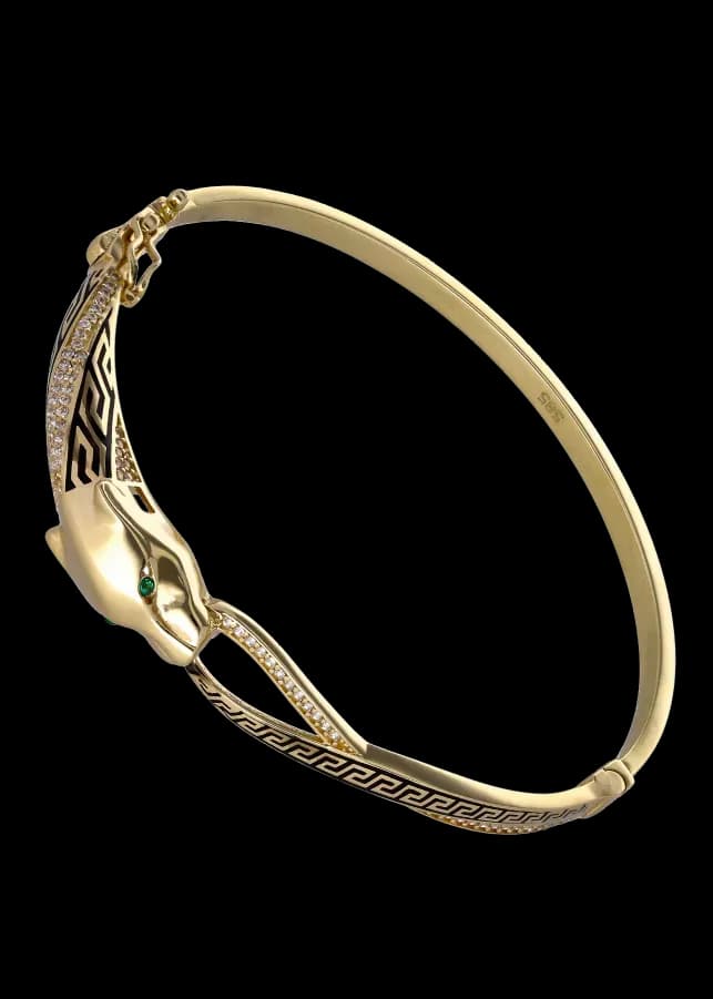 Armband i guld med panterhuvud, gröna ögon, diamanter och emalj