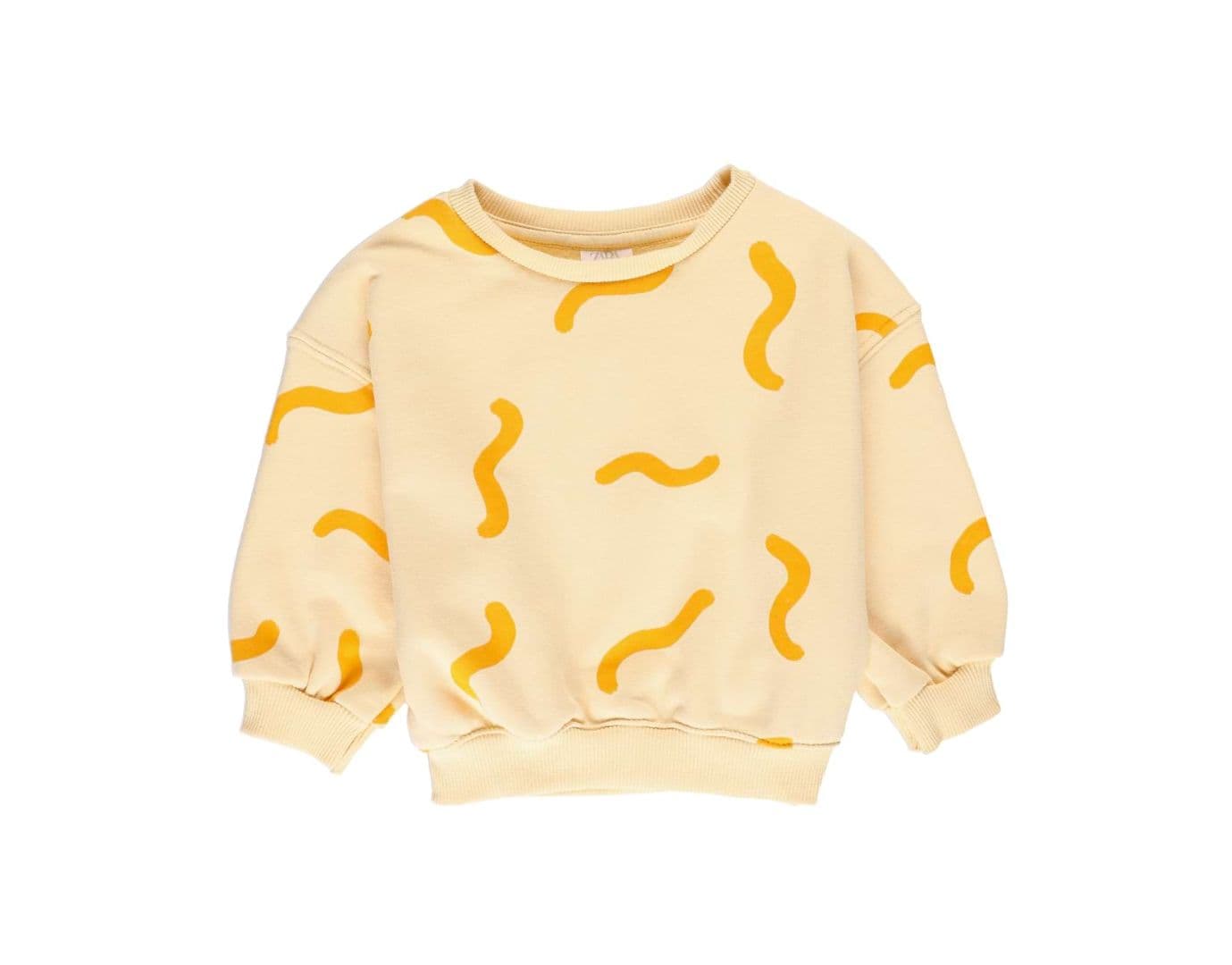 Flat lay-packshot av gul blus